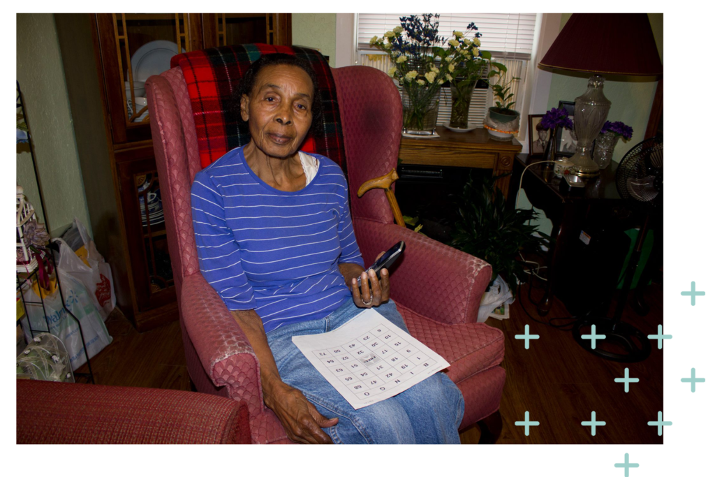 Person sitting in a chair on the phone