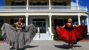 mexican dancers holding the skirts of their dresses