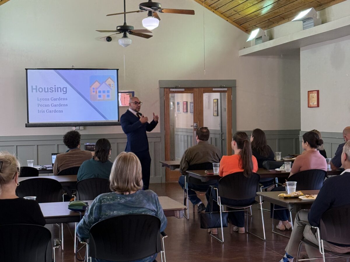 People sitting and watching a presentation