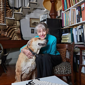 person sitting with a dog