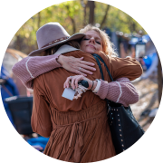 Client hugging an employee.